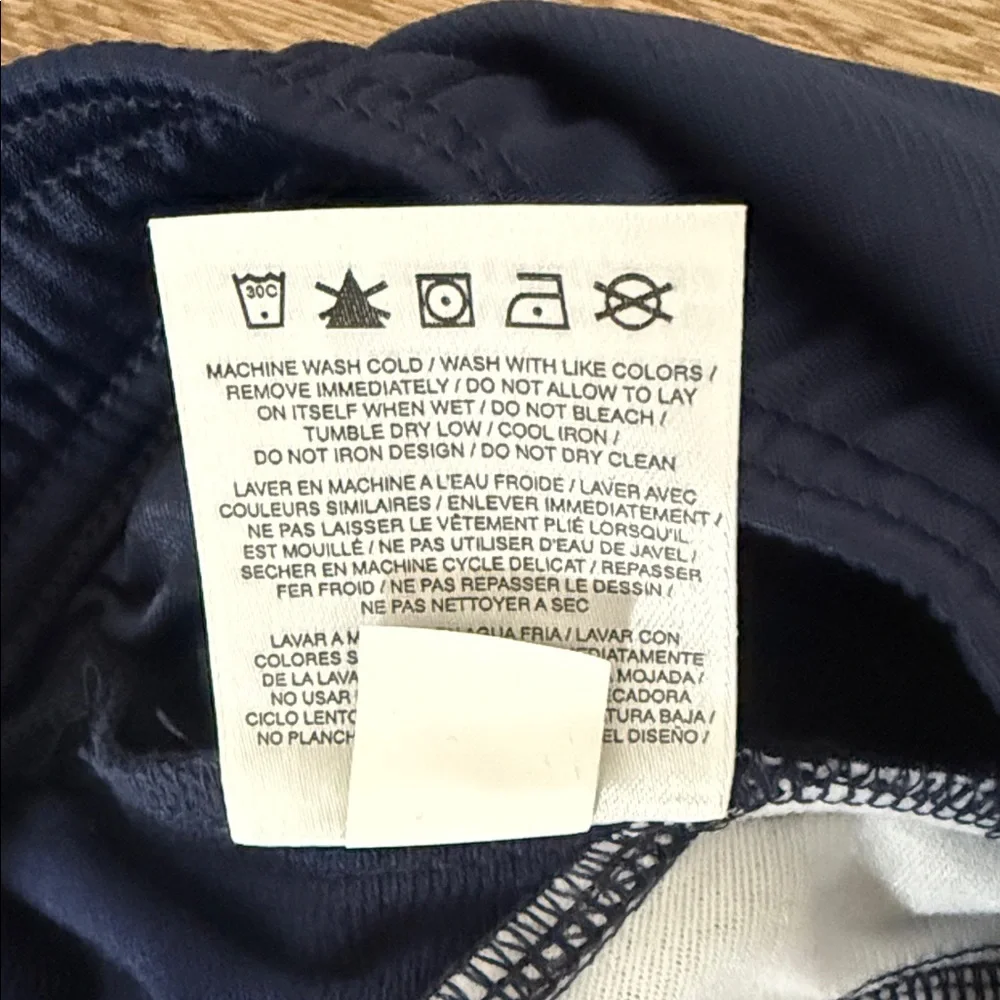 Nike Kids Navy Track Pants with White Side Stripes, Size Medium